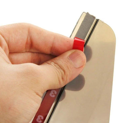 Durable Flexible Rain Shield for Car Rearview Mirrors, 2 Pack - close-up of hand peeling adhesive backing before attaching mirror rain shield