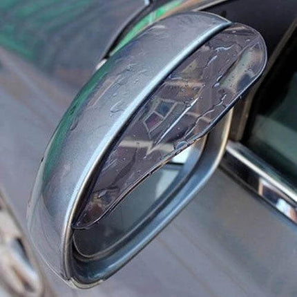 Durable Flexible Rain Shield for Car Rearview Mirrors, 2 Pack shown installed on a wet side mirror to deflect rain and keep visibility clear