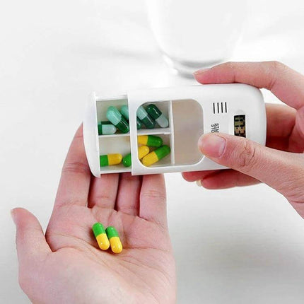 Smart Portable Pill Reminder Box With Multi Alarm Timer For Meds showing two large compartments dispensing green and yellow capsules into a hand
