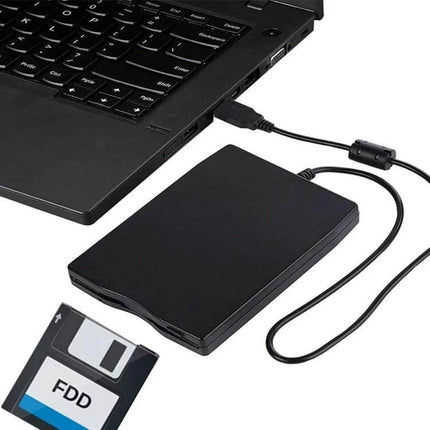 Portable USB External Floppy Disk Drive for 3.5 Inch Disks connected to laptop via USB cable with 3.5-inch floppy disk ready for data transfer