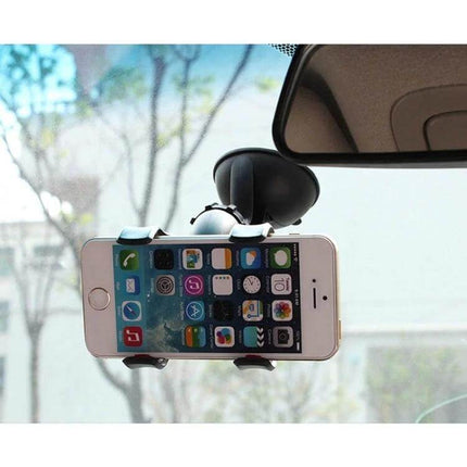 Universal 360 Degree Car Phone Holder For Smartphones And GPS Devices mounted on windshield holding smartphone in landscape for navigation and hands-free use
