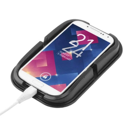 Universal Car Phone Holder With Washable Anti-Slip Pad on dashboard holding smartphone and charging cable, non-slip washable pad preventing sliding