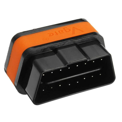 Handy Car Diagnostic Scanner for Everyday Vehicle Maintenance plugged into OBD2 port, compact orange-black dongle for driveway vehicle checks