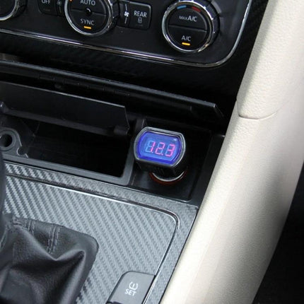 Handy Voltmeter for Monitoring Car Battery Levels on Drives plugged into cigarette lighter showing 12.3V display in car console