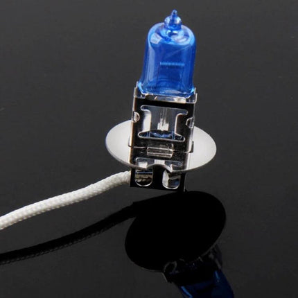 Xenon Style Car Headlight Bulb For Clear Night Driving - blue halogen-style bulb on reflective black surface, energy-efficient bright night lighting