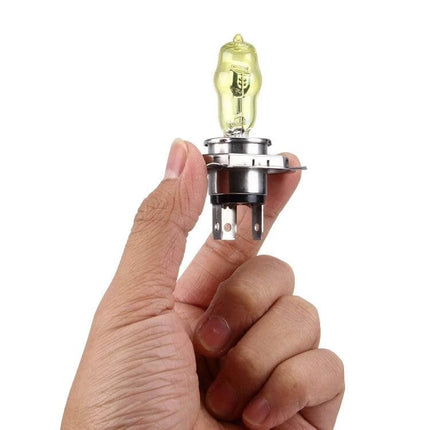 H4 Xenon Pure Yellow Headlight Bulbs For Cars Daily Driving - hand holding yellow H4 bulb showcasing xenon design and plug connectors
