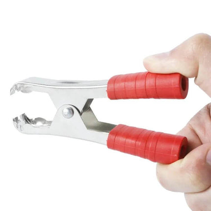 100A Car Battery Terminal Alligator Clips, For Battery Charging Pair showing red insulated handle and iron-plated copper jaws held in hand