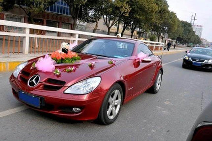 Transparent Double Sided Adhesive Tape for Repairs and Bonding used to attach wedding car decorations on red Mercedes sports coupe