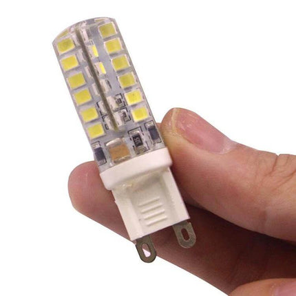 G9 3W Car LED Bulb For Interior Cabin Lighting Daily Use - close-up of compact G9 LED replacement held between fingers, low-profile dome/map light fit