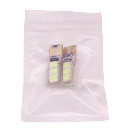 Ice Blue Vehicle LED Bulbs for Turn Signals and Brake Lights in clear retail pouch showing dual T10 LED bulbs for turn signals, tail and brake lights