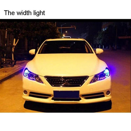 Two Pack 39mm White LED License Plate Reading Lights installed on front of white car illuminating license plate area at night