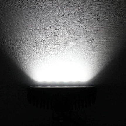 MZ Car Work Light Bar for Night Repairs and Roadside Tasks illuminating wall with focused LED beam, compact aluminum housing and bright output