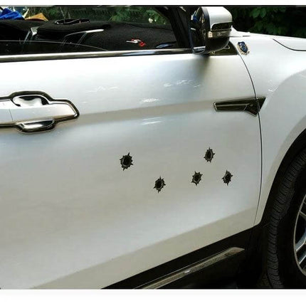Set of 6 Bullet Hole Decorative Stickers for Cars, 4cm x 4cm on white SUV door shown in a cluster, removable faux bullet hole decals