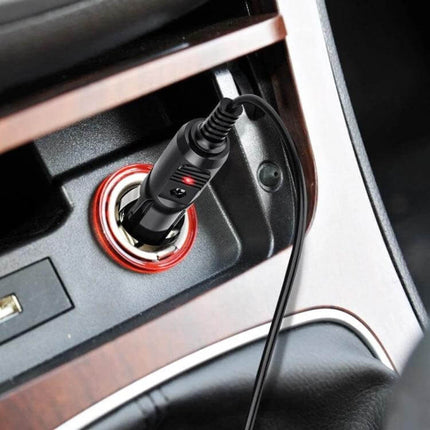 2A Coiled Cable DC Power Supply Adapter for Car Charging plugged into a car 12V socket with coiled cable managing length and charging a device