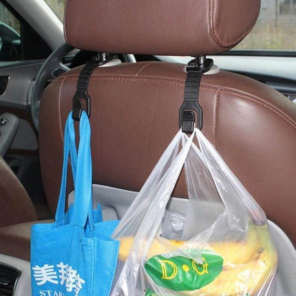 Plastic Car Seat Back Bottle And Bag Holder Hook For Backseat Use - black plastic hooks holding bags and groceries on a brown car seatback