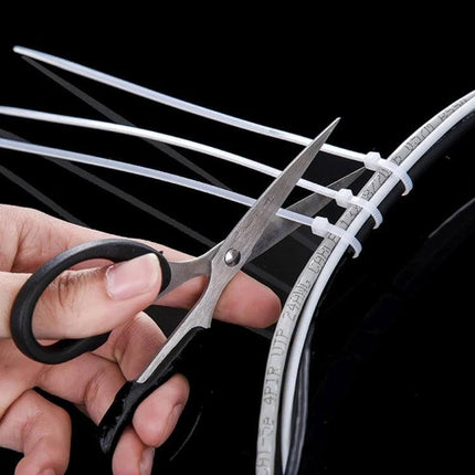 Self-Locking Nylon Cable Ties, 3mm x 150mm, Black and White Pack of 500 - white ties bundling computer cables being trimmed with scissors