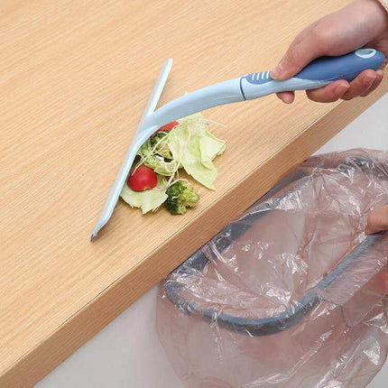 KANEED 24.5 x 24cm Car Window Glass Wiper with Plastic Handle being used to sweep tabletop crumbs into a bin, anti-slip plastic handle
