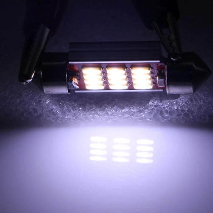 Car License Plate Lights 39mm CANBUS LED Bulbs 2 Pack glowing white LED festoon bulb installed for license plate illumination