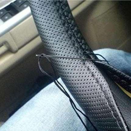 PU Leather Steering Wheel Cover With Needle And Thread 54x10.5cm installed on 38cm wheel showing perforated black PU leather and included needle/thread for DIY fit