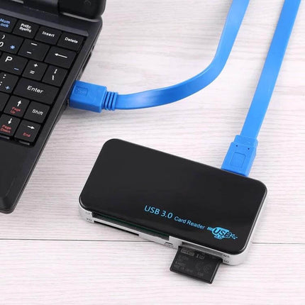 USB 3.0 Card Reader for Various Memory Cards and Devices connected to laptop with blue USB 3.0 cable and inserted SD card
