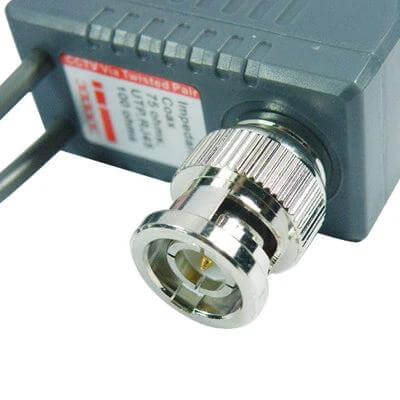 CCTV Balun Transceiver Cable for Video and Power Transmission BNC connector close-up on gray balun adapter