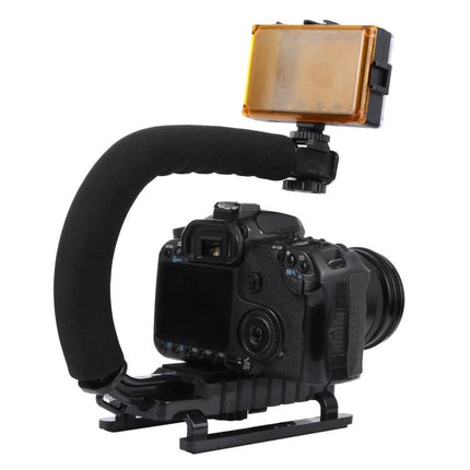 C-Shape Handle Mount for Stable DSLR and Camcorder Shooting with foam grip, DSLR on baseplate and top LED light for steady video