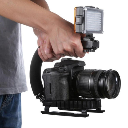 C-Shape Handle Mount for Stable DSLR and Camcorder Shooting handheld setup with DSLR, camcorder and LED light for steady video