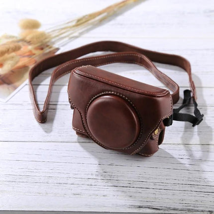 Retro Style PU Leather Camera Case for Sony RX100 Cameras brown vintage protective case with strap on white wood surface