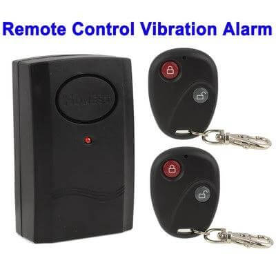 Wireless Vibration Alarm with Remote Control for Home Security - black vibration sensor and two remote keyfob controls for door/window protection