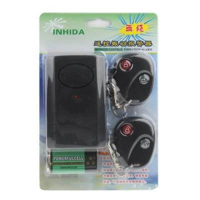 Wireless Vibration Alarm with Remote Control for Home Security - black unit with two keyfob remotes and battery in retail packaging