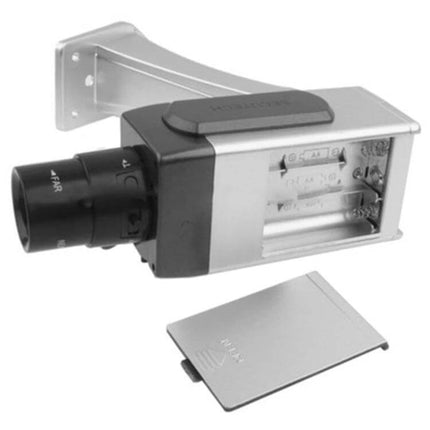 Wireless Fake Security Camera for Home Protection showing silver wall-mounted dummy camera with open battery compartment