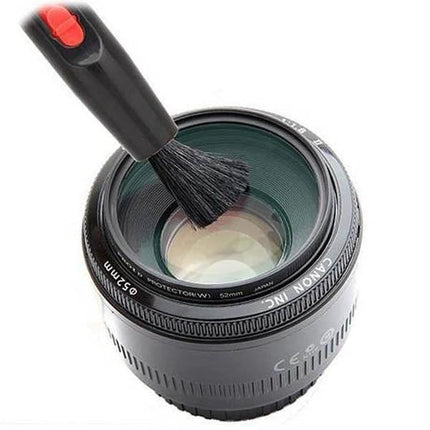 Practical 3-in-1 Cleaning Kit for Camera Lens Maintenance and Care brush gently cleaning DSLR lens to remove dust and smudges