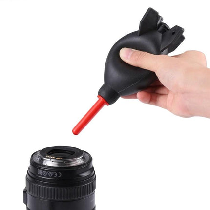 Rubber Dust Blower Ball for Cleaning Cameras and Electronics blowing dust from a camera lens, silicone bulb with red nozzle