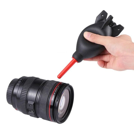 Rubber Dust Blower Ball for Cleaning Cameras and Electronics - hand-held silicone blower removing dust from camera lens