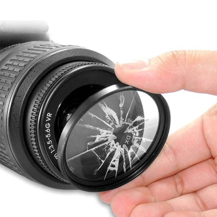 Kenko Optical 77mm UV Filter for Camera Lens Protection showing cracked protective filter being removed from lens