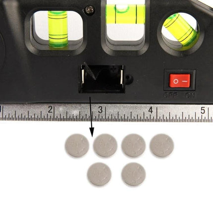 Laser Level Tool with Measuring Tape for Home Alignment Projects showing vials, power switch, ruler and button cell batteries