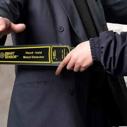 Compact Handheld Metal Detector for Security and Daily Checks being used for a discreet school entrance security screening with vibration and mute options