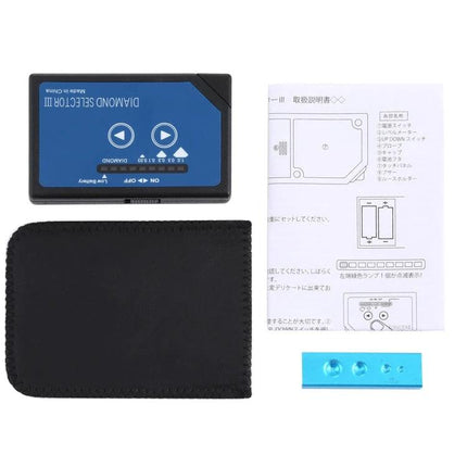 Compact Portable Diamond Selector for Quick Gem Testing showing device, neoprene pouch, instruction sheet and blue test block