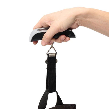 Mini Handheld Luggage Scale 50 Kg Capacity For Easy Weighing - compact handheld scale weighing a bag with strap, 50 kg capacity, easy LCD readout