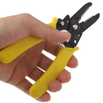 Copper Wire Stripper Pliers For Electrical Wiring Projects - hand holding yellow-handled pliers stripping copper wire, precision blades for AWG 10–22
