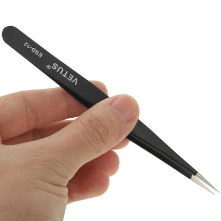 Precision Anti-Static Tweezers for Electronics Handling - black ESD-12 tweezers held over a circuit board for safe ESD-sensitive component placement