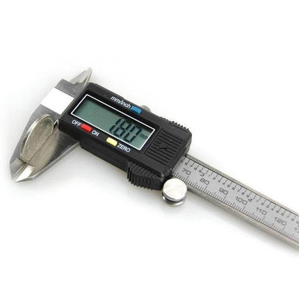LCD Digital Vernier Caliper 150 Mm Range For Everyday Measuring - stainless steel caliper with LCD display measuring coin at 18.00 mm