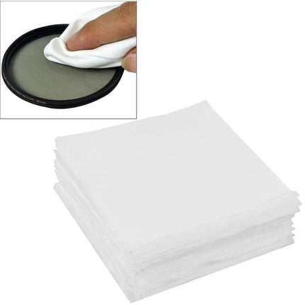 100 Pack Soft Cleaning Cloths for Eyeglasses and Screens - stack of white microfiber cloths being used to gently wipe a lens