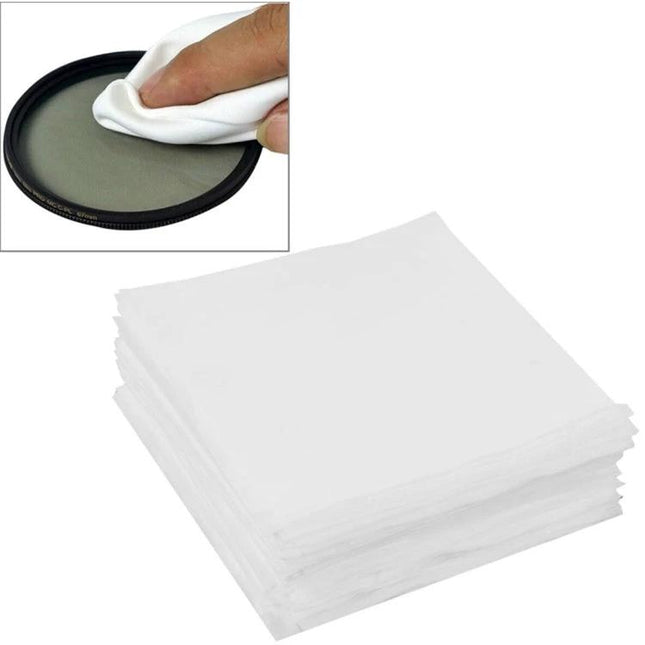 100 Pack Soft Cleaning Cloths for Eyeglasses and Screens - stack of white microfiber cloths being used to gently wipe a lens