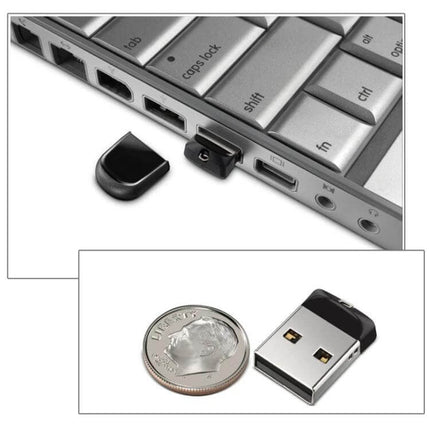 Compact 32GB USB Flash Drive with Keychain for Portable Storage inserted into laptop USB port with cap off and shown next to a coin