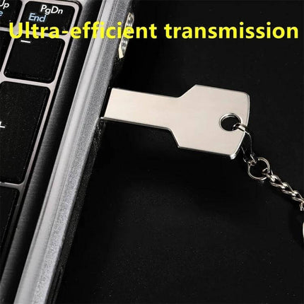 Compact USB Flash Drive with 8GB Storage for File Transfer plugged into laptop keyboard, compact metal key-shaped USB 2.0 for portable file transfer