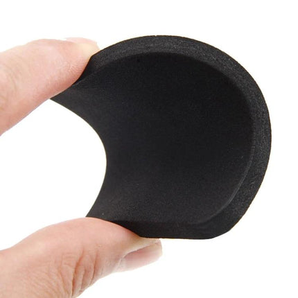 Pads for Quieter Home Laundry to Reduce Washing Machine Vibration - black anti-vibration foam pad held between fingers for quieter laundry