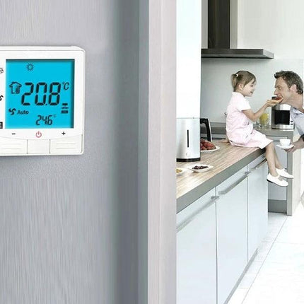 Programmable Thermostat for Room Temperature Control in Air Conditioning mounted on wall with family in kitchen