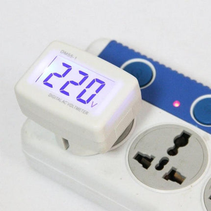 Digital AC Voltage Meter for Measuring 110-300V Household Circuits showing 220V reading on white ABS housing plugged into a power strip