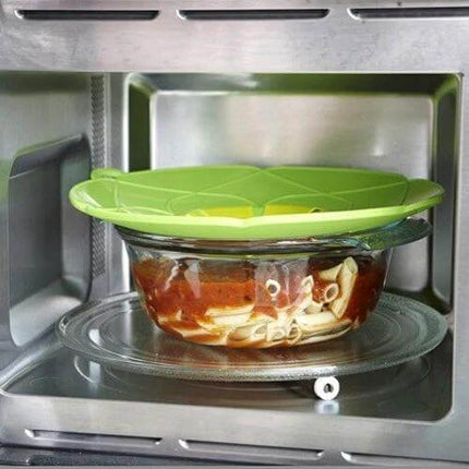 Spill Proof Silicone Pot Cover Prevents Boil Overs Fits 6 to 9.5 in - green silicone lid on glass bowl in microwave preventing splatter